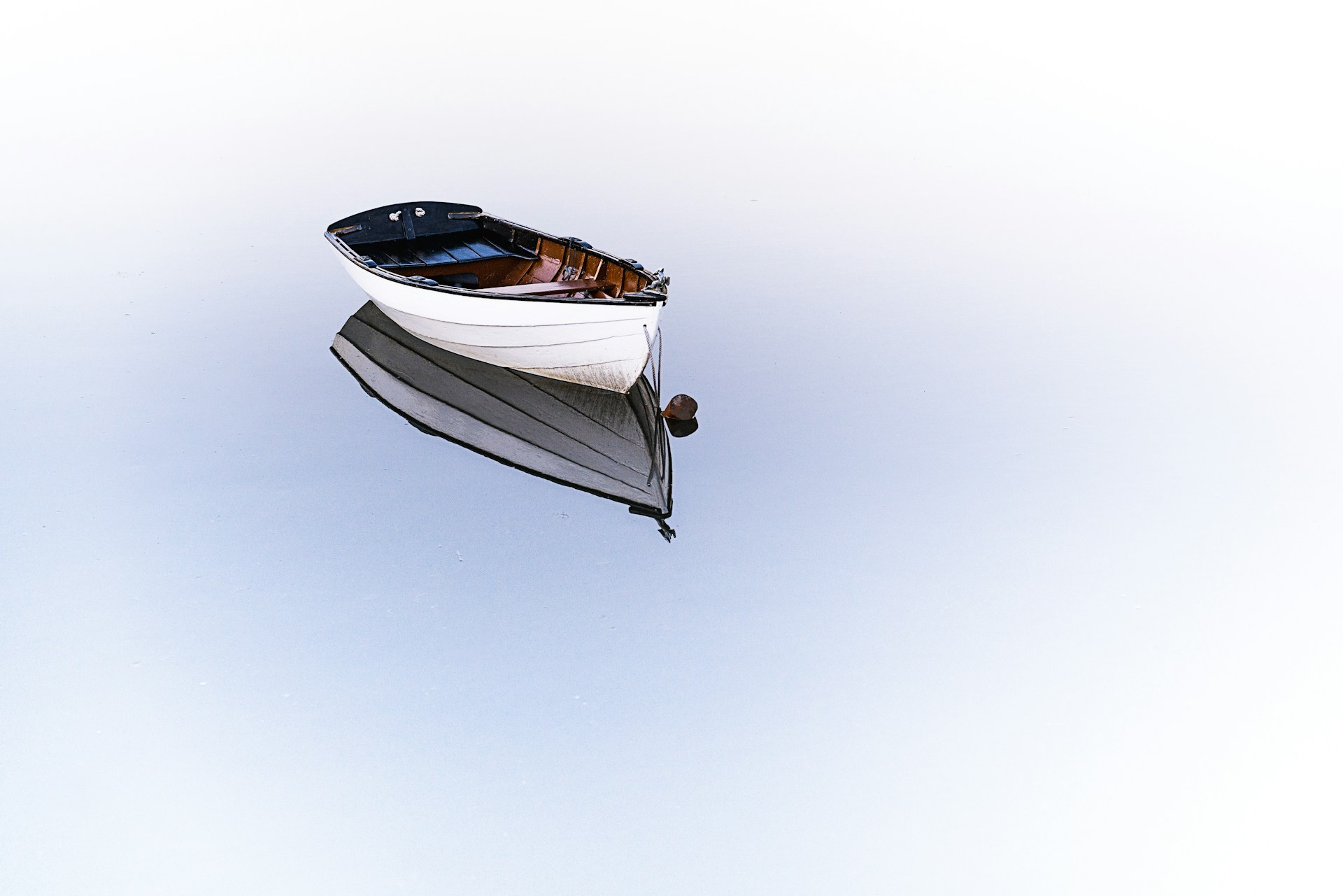 White boat on still water.